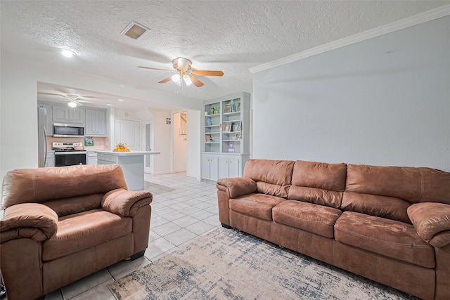 13351 Oak Leaf Ln, Houston, TX 77015 - living area with a ceiling fan, a textured ceiling, light tile patterned flooring, and crown molding