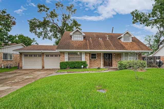 13351 Oak Leaf Ln, Houston, TX 77015 - cape cod home with an attached garage, brick siding, concrete driveway, and roof with shingles
