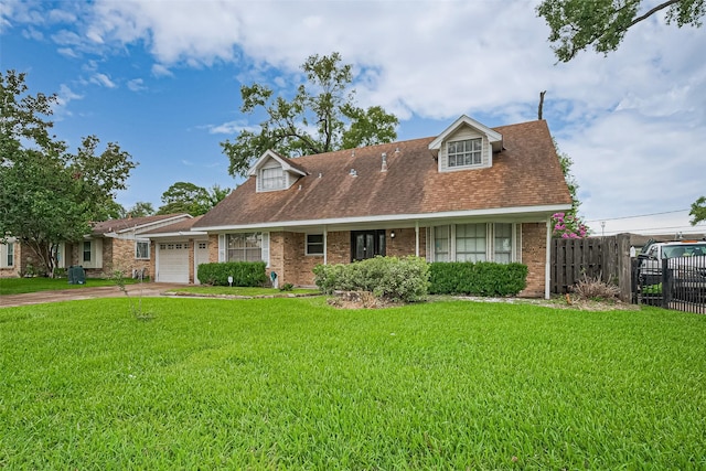 13351 Oak Leaf Ln, Houston, TX 77015 - cape cod-style house featuring an attached garage, concrete driveway, brick siding, and a shingled roof