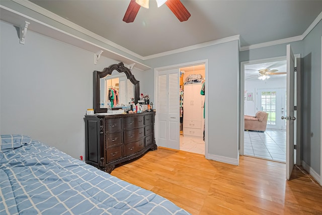 13351 Oak Leaf Ln, Houston, TX 77015 - bedroom featuring light wood finished floors, crown molding, and a ceiling fan