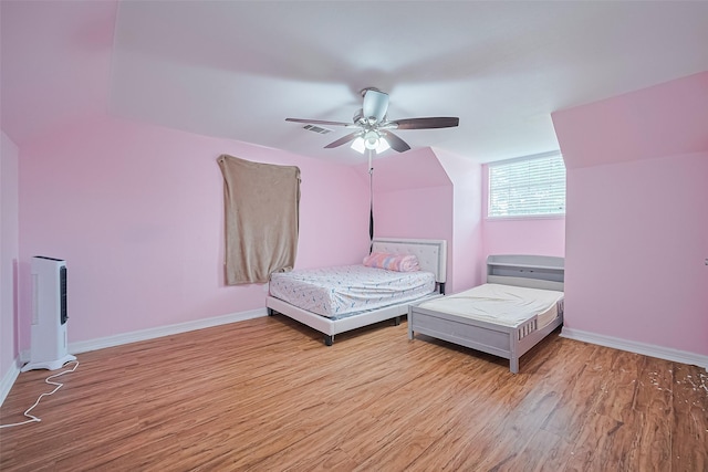 13351 Oak Leaf Ln, Houston, TX 77015 - bedroom with light wood finished floors and a ceiling fan