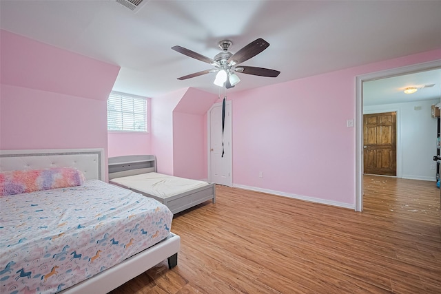 13351 Oak Leaf Ln, Houston, TX 77015 - bedroom with wood finished floors and a ceiling fan