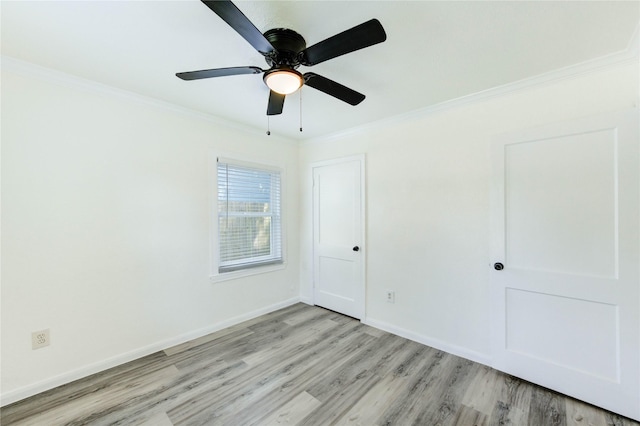 5326 Keystone St, Houston, TX 77021 - unfurnished bedroom featuring ornamental molding, light wood-style flooring, and a ceiling fan