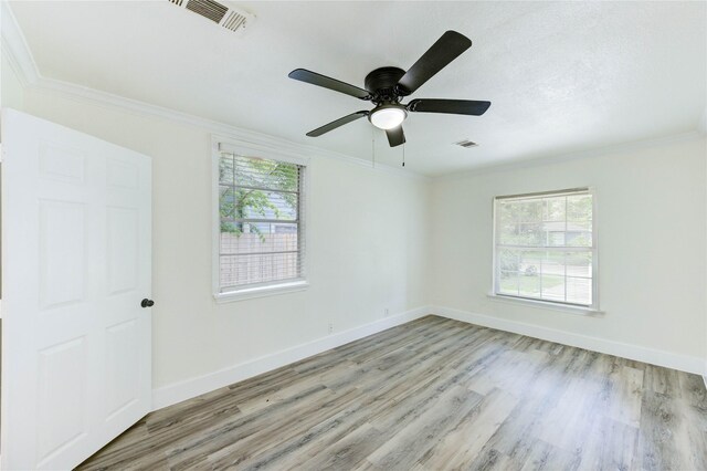 5326 Keystone St, Houston, TX 77021 - empty room featuring wood finished floors, crown molding, and ceiling fan