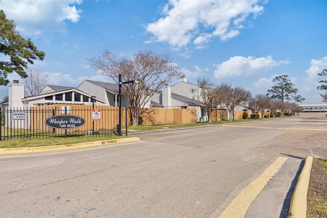 6401 Deihl Rd Unit 1401, Houston, TX 77092 - view of asphalt road featuring curbs, street lighting, and a residential view