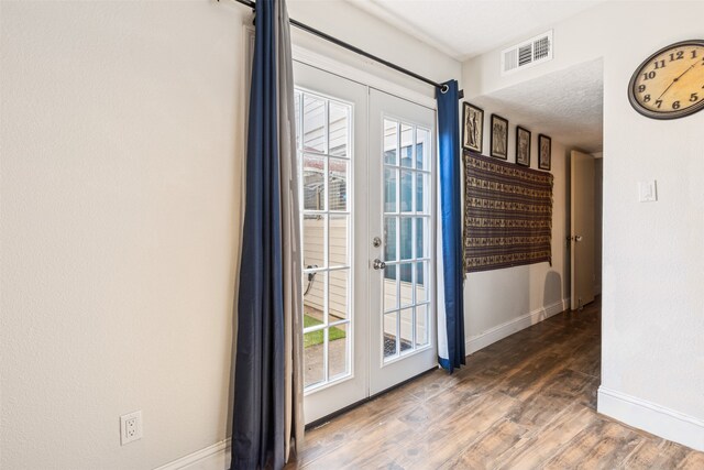 6401 Deihl Rd Unit 1401, Houston, TX 77092 - doorway with french doors and wood finished floors