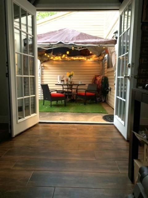 6401 Deihl Rd Unit 1401, Houston, TX 77092 - doorway to outside featuring wood finished floors