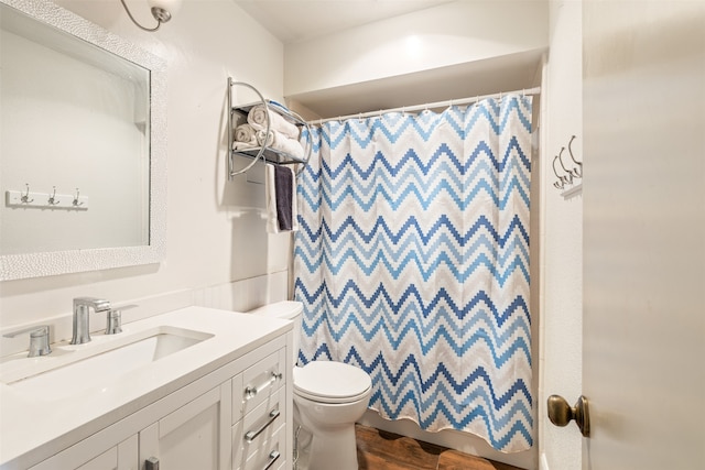 6401 Deihl Rd Unit 1401, Houston, TX 77092 - full bath featuring vanity, a shower with shower curtain, and wood finished floors