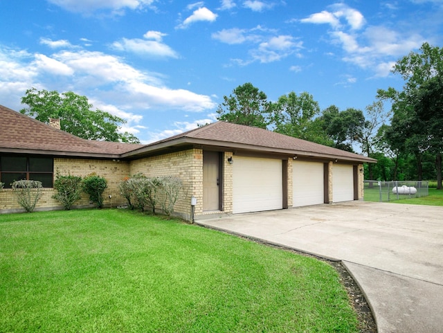 413 Christensen Rd, Hankamer, TX 77560 - view of front of house featuring brick siding, concrete driveway, and a shingled roof