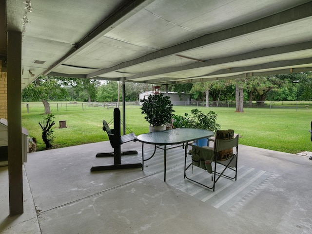 413 Christensen Rd, Hankamer, TX 77560 - fenced backyard featuring a patio