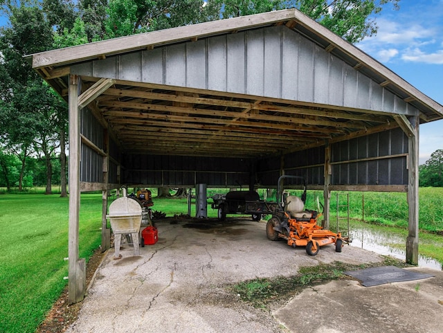 413 Christensen Rd, Hankamer, TX 77560 - view of car parking featuring a detached carport and an outbuilding