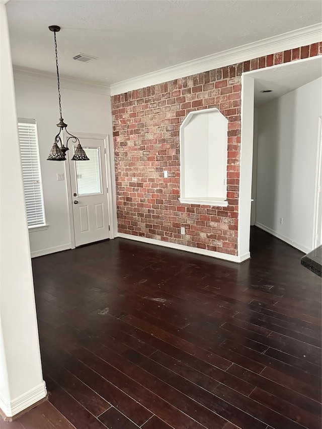 14919 Hyde Park Pl, Houston, TX 77069 - unfurnished living room featuring hardwood / wood-style floors, crown molding, and brick wall