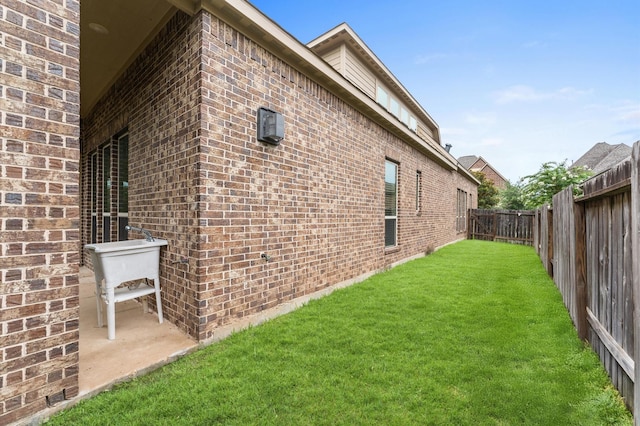13207 Parkway Meadows Dr, Houston, TX 77077 - view of property exterior with brick siding and a fenced backyard