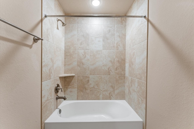 13207 Parkway Meadows Dr, Houston, TX 77077 - bathroom with tub / shower combination and a textured wall