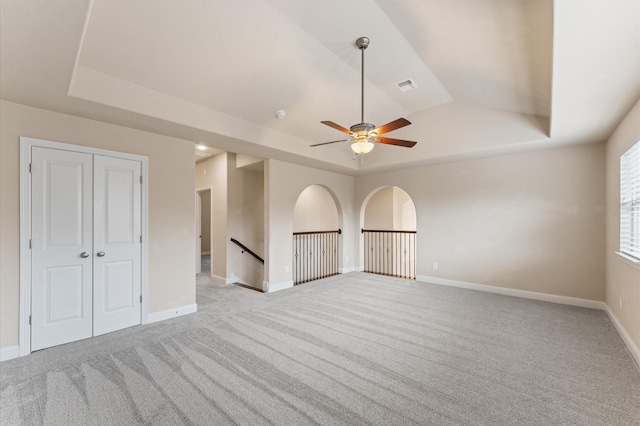 13207 Parkway Meadows Dr, Houston, TX 77077 - unfurnished room with a raised ceiling, a ceiling fan, and light colored carpet