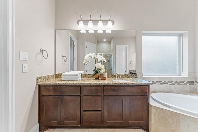 13207 Parkway Meadows Dr, Houston, TX 77077 - bathroom with double vanity, a stall shower, and a garden tub