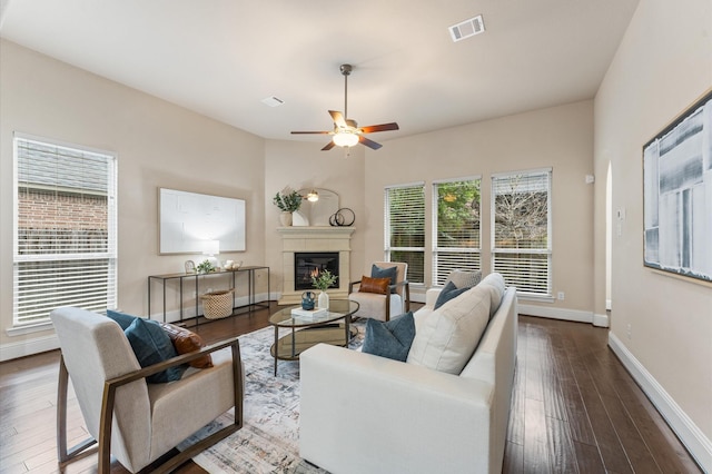 13207 Parkway Meadows Dr, Houston, TX 77077 - living area featuring a glass covered fireplace, wood-type flooring, and ceiling fan