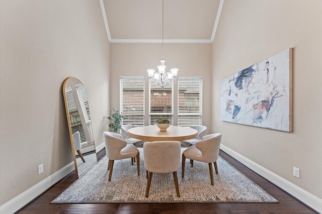 13207 Parkway Meadows Dr, Houston, TX 77077 - dining space featuring ornamental molding, a chandelier, dark wood finished floors, and a high ceiling