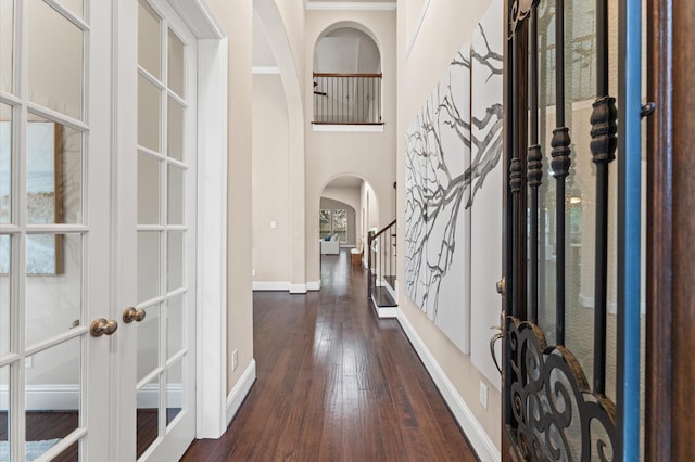 13207 Parkway Meadows Dr, Houston, TX 77077 - entryway with arched walkways, dark wood-style flooring, french doors, and stairs