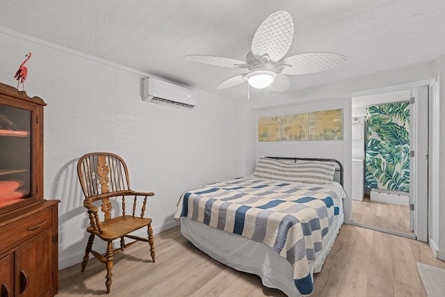 106 E Madison Ave, Port O Connor, TX 77982 - bedroom with a wall mounted AC, light wood-type flooring, and ceiling fan