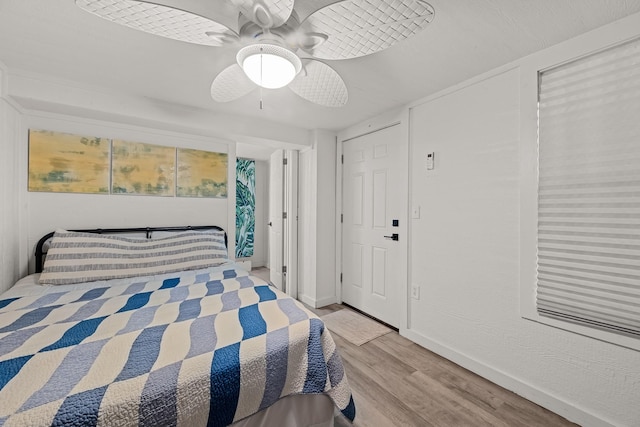 106 E Madison Ave, Port O Connor, TX 77982 - bedroom featuring light wood-type flooring and a ceiling fan