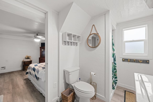 106 E Madison Ave, Port O Connor, TX 77982 - bathroom featuring wood finished floors, ceiling fan, and connected bathroom