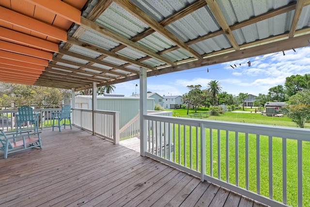 106 E Madison Ave, Port O Connor, TX 77982 - wooden terrace with a lawn and a residential view