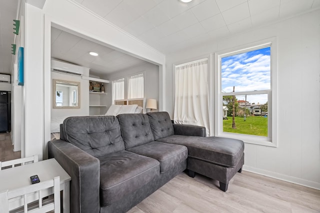106 E Madison Ave, Port O Connor, TX 77982 - living room with light wood-type flooring and a wall unit AC