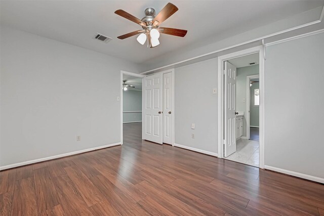 1903 Wagon Gap Trl, Houston, TX 77090 - unfurnished bedroom featuring wood finished floors, ceiling fan, and a closet