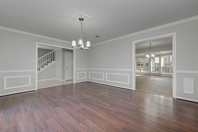 1903 Wagon Gap Trl, Houston, TX 77090 - unfurnished dining area featuring a chandelier, crown molding, stairway, wood finished floors, and a wainscoted wall