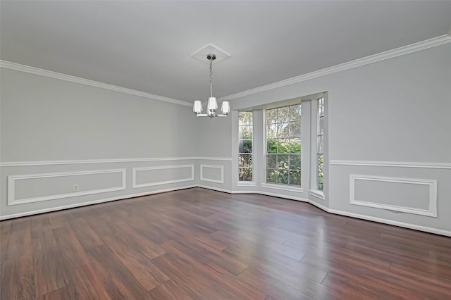 1903 Wagon Gap Trl, Houston, TX 77090 - unfurnished dining area featuring a chandelier, ornamental molding, dark wood finished floors, wainscoting, and a decorative wall