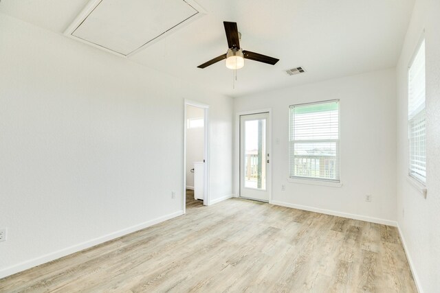 344 Thunder Rd, Surfside Beach, TX 77541 - empty room featuring attic access, light wood-style floors, and a ceiling fan