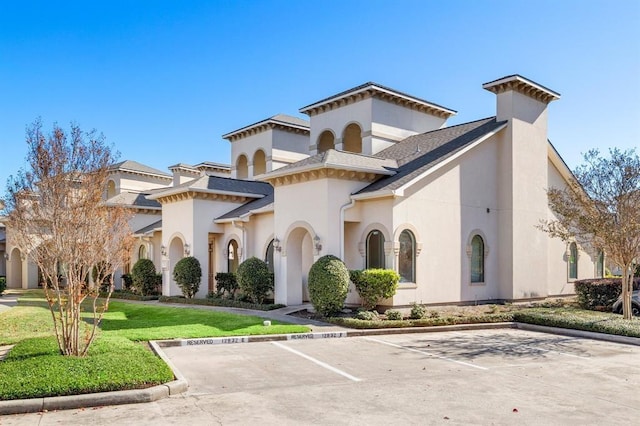 12832 Willow Centre Drive E And F, Houston, TX 77066 - view of front of home with stucco siding, uncovered parking, and a front yard