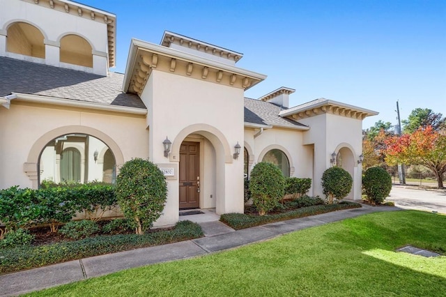 12832 Willow Centre Drive E And F, Houston, TX 77066 - view of front of house with a front yard, stucco siding, and a shingled roof