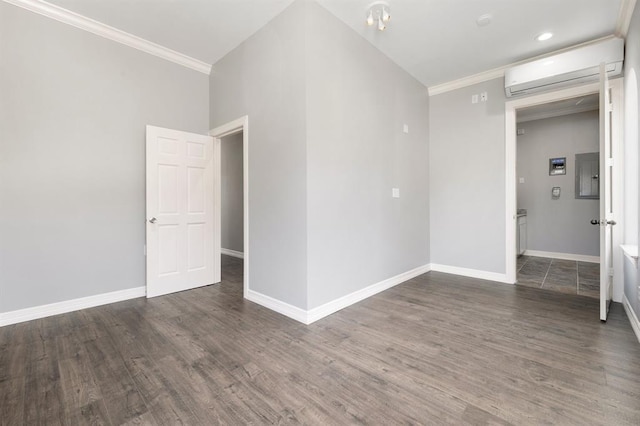 12832 Willow Centre Drive E And F, Houston, TX 77066 - spare room featuring a wall unit AC, electric panel, ornamental molding, wood finished floors, and recessed lighting