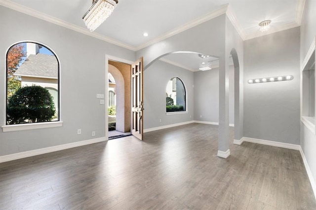 12832 Willow Centre Drive E And F, Houston, TX 77066 - entrance foyer with arched walkways, healthy amount of natural light, wood finished floors, ornamental molding, and recessed lighting