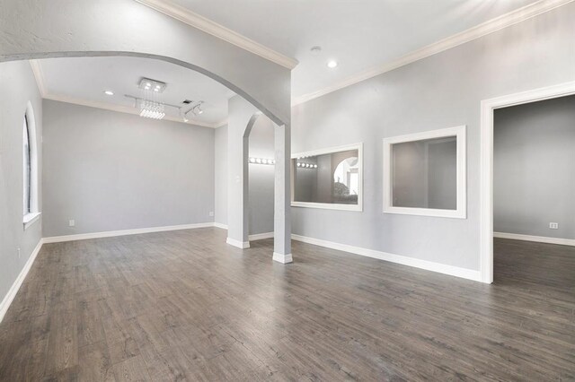 12832 Willow Centre Drive E And F, Houston, TX 77066 - unfurnished living room featuring dark wood-style floors, arched walkways, ornamental molding, and recessed lighting