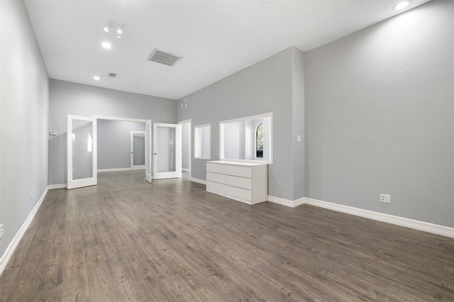 12832 Willow Centre Drive E And F, Houston, TX 77066 - unfurnished living room with dark wood-type flooring and recessed lighting
