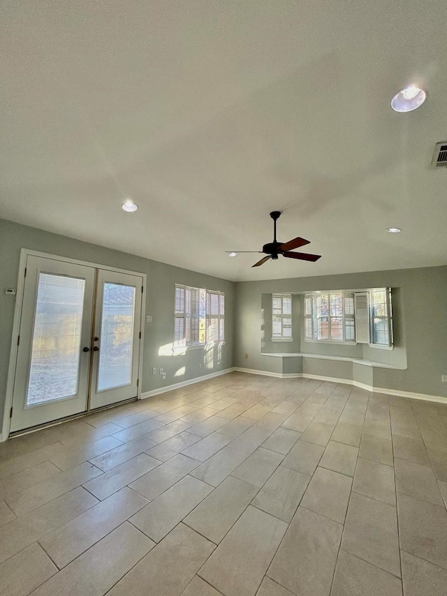15231 Falling Creek Dr, Houston, TX 77068 - empty room with ceiling fan, recessed lighting, light tile patterned flooring, and french doors