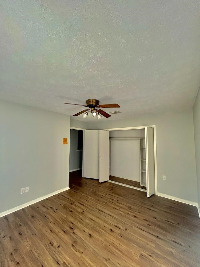 15231 Falling Creek Dr, Houston, TX 77068 - unfurnished bedroom with wood finished floors, a textured ceiling, and a ceiling fan