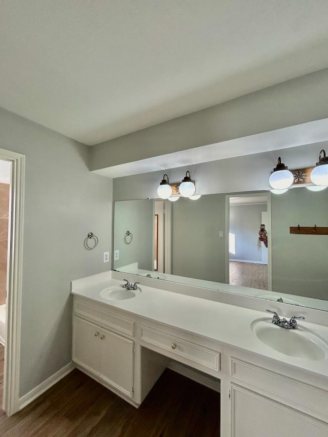 15231 Falling Creek Dr, Houston, TX 77068 - full bath with wood finished floors and double vanity