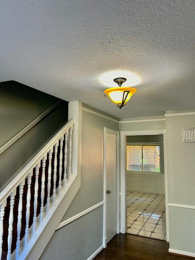15231 Falling Creek Dr, Houston, TX 77068 - corridor featuring a textured ceiling and wood finished floors