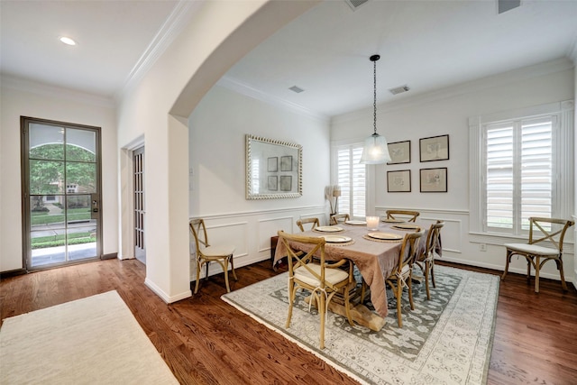 4004 Childress St, Houston, TX 77005 - dining area with arched walkways, dark wood-style flooring, ornamental molding, wainscoting, and recessed lighting