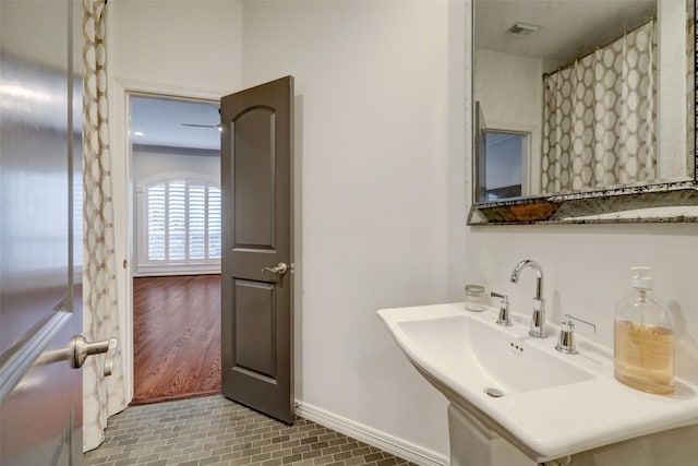 4004 Childress St, Houston, TX 77005 - bathroom with baseboards and a sink