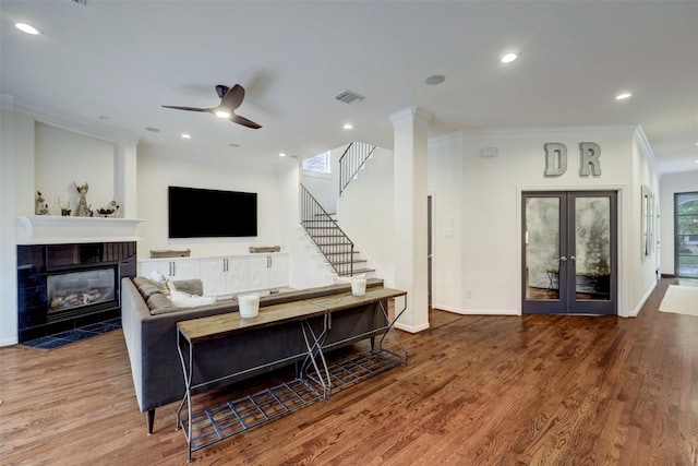 4004 Childress St, Houston, TX 77005 - living area featuring crown molding, wood finished floors, ceiling fan, recessed lighting, and a fireplace
