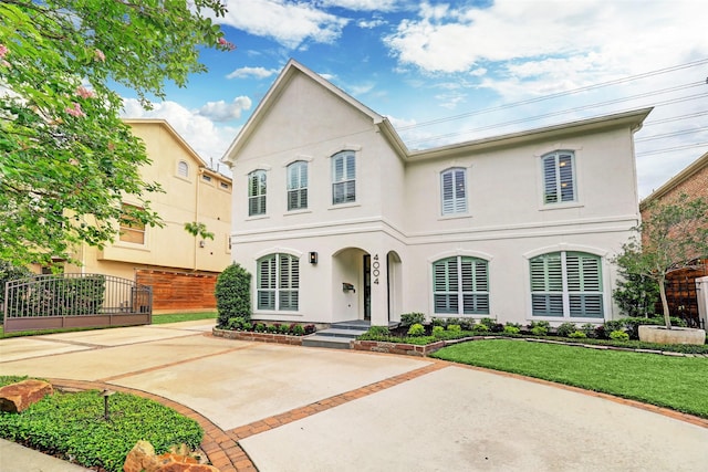 4004 Childress St, Houston, TX 77005 - view of front facade featuring stucco siding and a front lawn