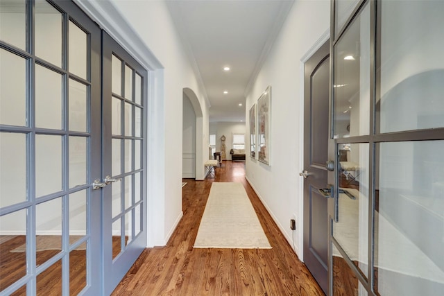 4004 Childress St, Houston, TX 77005 - corridor with french doors, arched walkways, wood finished floors, crown molding, and recessed lighting