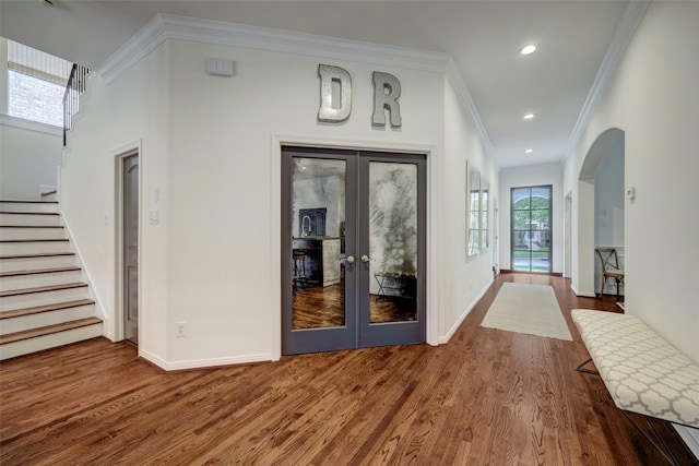 4004 Childress St, Houston, TX 77005 - entryway featuring wood finished floors, crown molding, stairway, french doors, and arched walkways