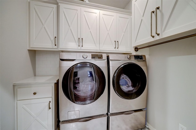 4004 Childress St, Houston, TX 77005 - laundry room featuring cabinet space and independent washer and dryer