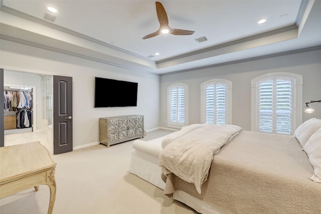 4004 Childress St, Houston, TX 77005 - carpeted bedroom featuring a tray ceiling, ornamental molding, recessed lighting, a walk in closet, and ceiling fan
